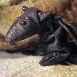 A black dragon plush